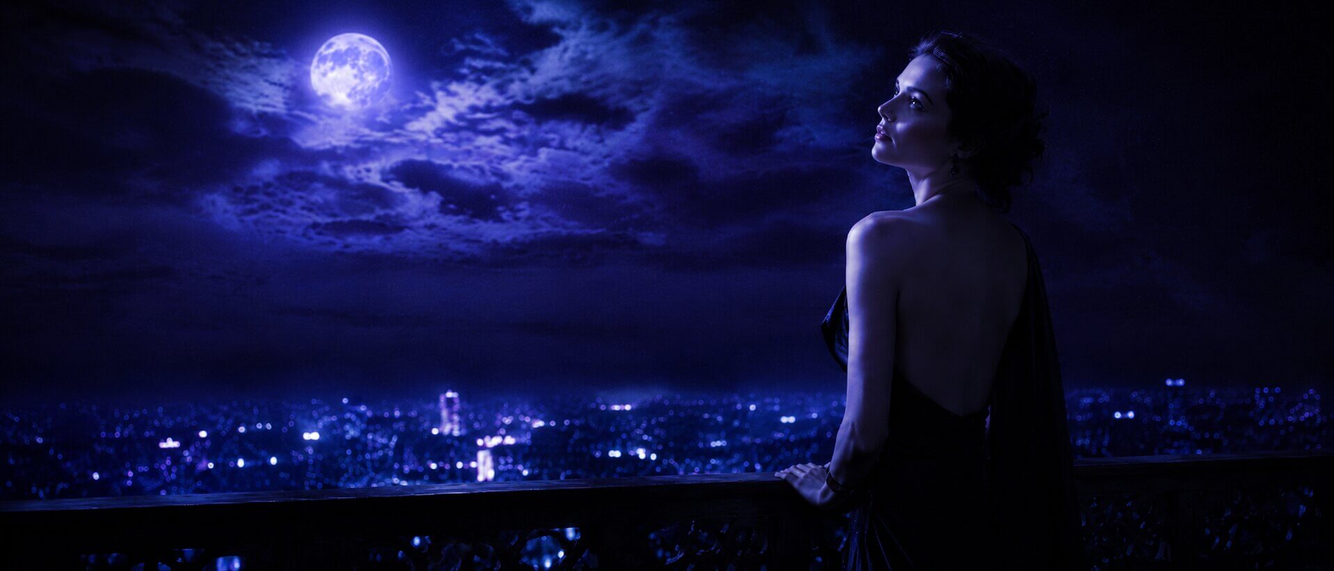 Moonrise Models — a woman stepping into her light in a cinematic, dark-luxury setting